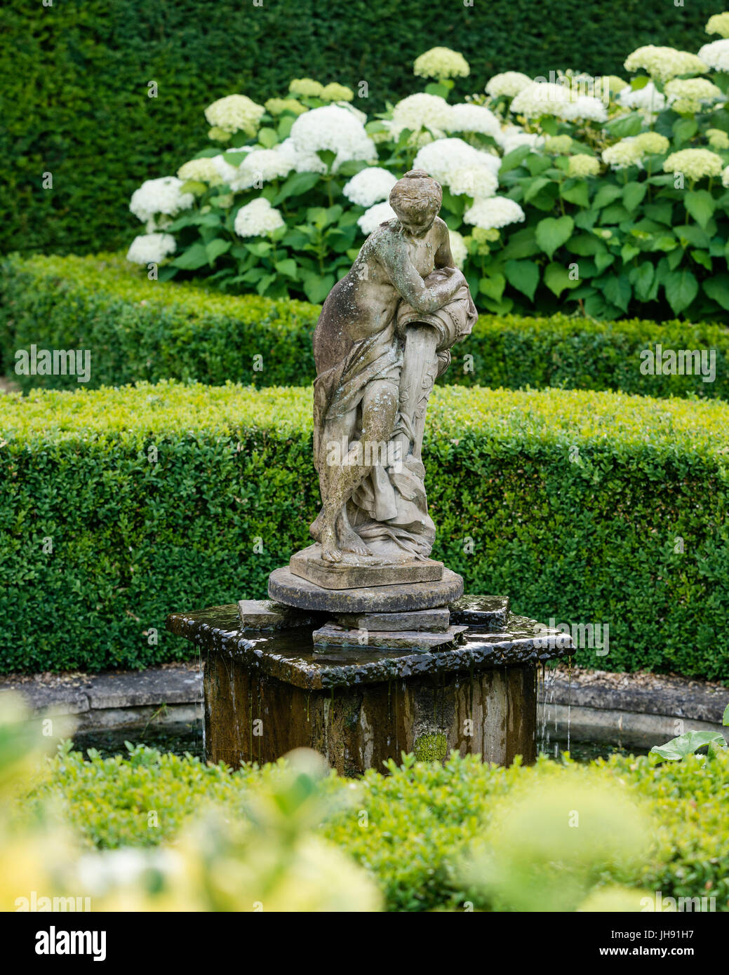 Sculpture of woman in garden Stock Photo