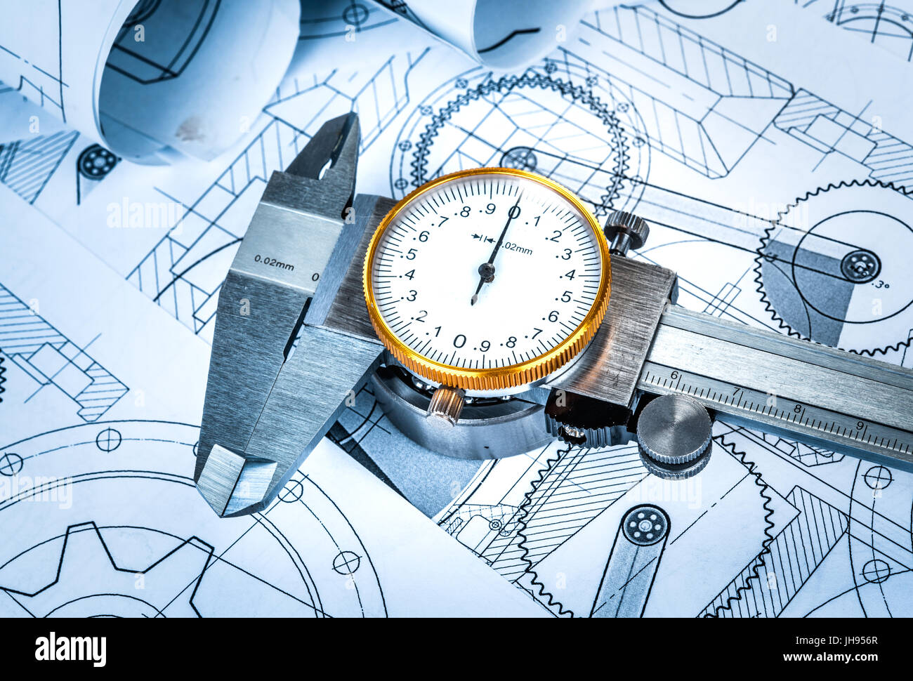 Metal vernier caliper and Ball bearings on technical drawing a blue
