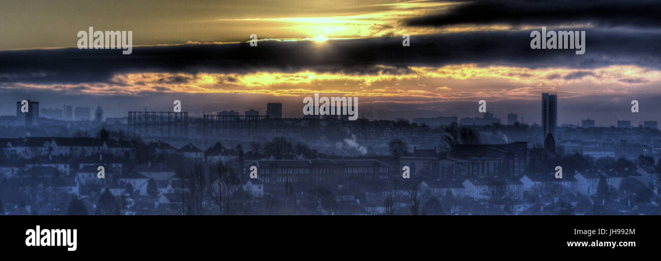Glasgow city panoramic wide view looking east sunrise over the west  end cityscape skyline dark stormy clouds Stock Photo