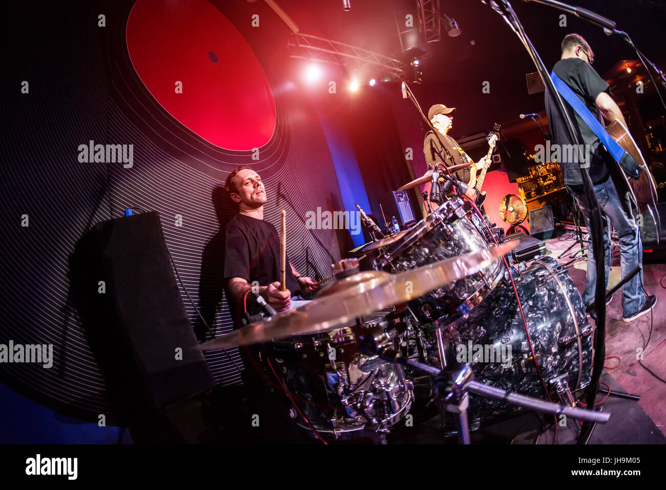 musician playing drums on stage, rock music concert Stock Photo - Alamy