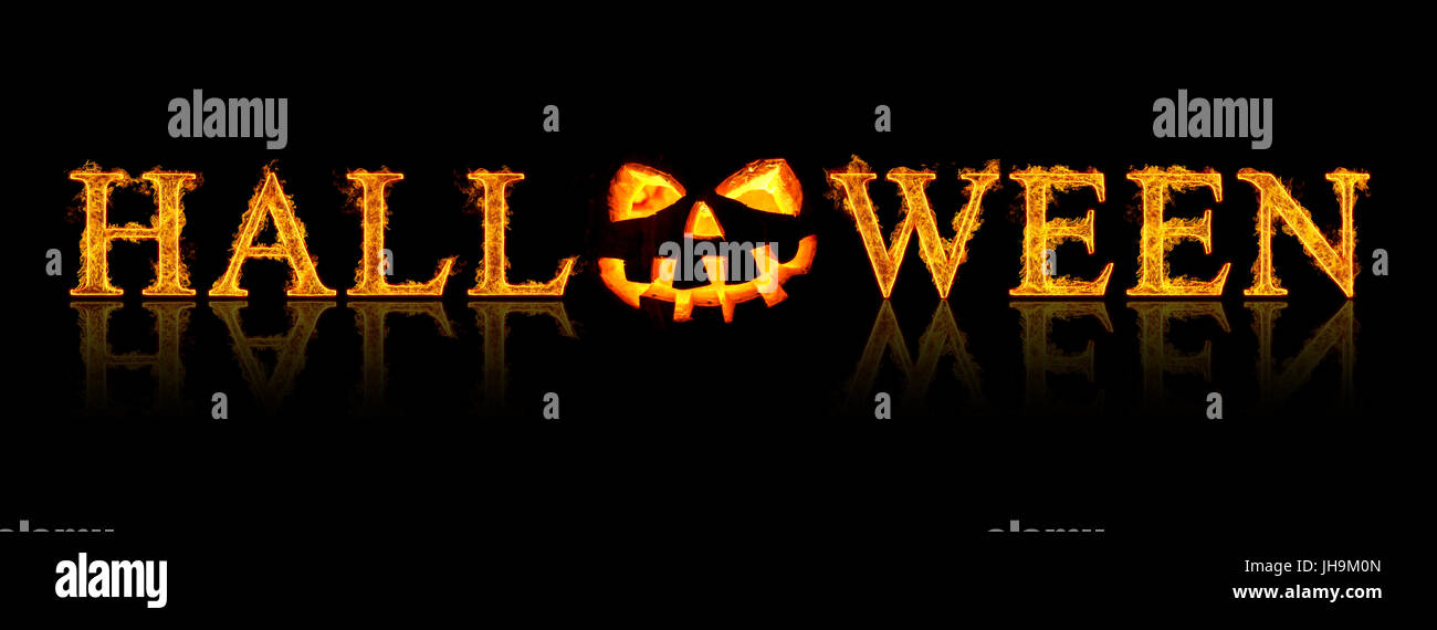 Halloween text - old jack-o-lantern on black background Stock Photo