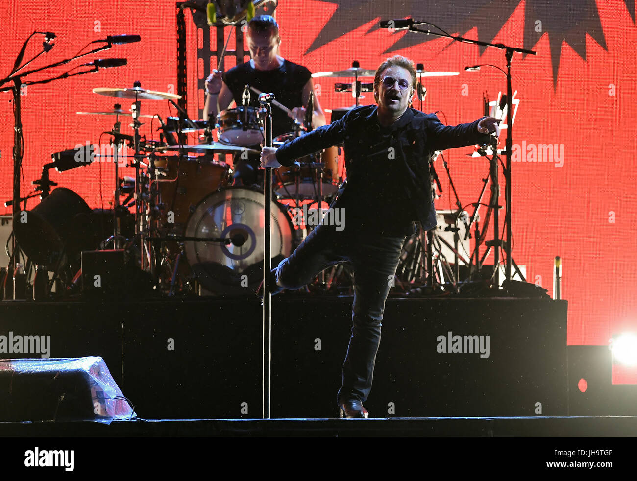 Berlin, Germany. 12th July, 2017. dpatop - Musicians Larry Mullen junior (l) and Paul David Hewson (Bono), singer of the Irish band U2, on stage at the Olympic Stadium in Berlin, Germany, 12 July 2017. Photo: Britta Pedersen/dpa-Zentralbild/dpa/Alamy Live News Stock Photo