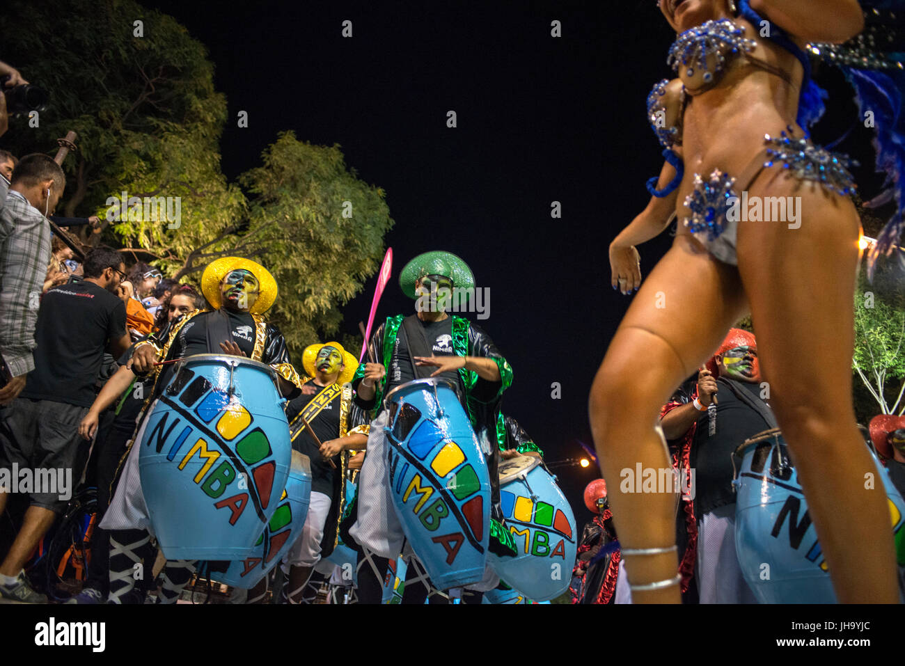 Traditional Murgas and samba schools during the Llamadas (the calling) procession that officially starts the carnival in Montevideo, Uruguay. Is the longest carnival in the world, lasting almost 5 weeks. Stock Photo
