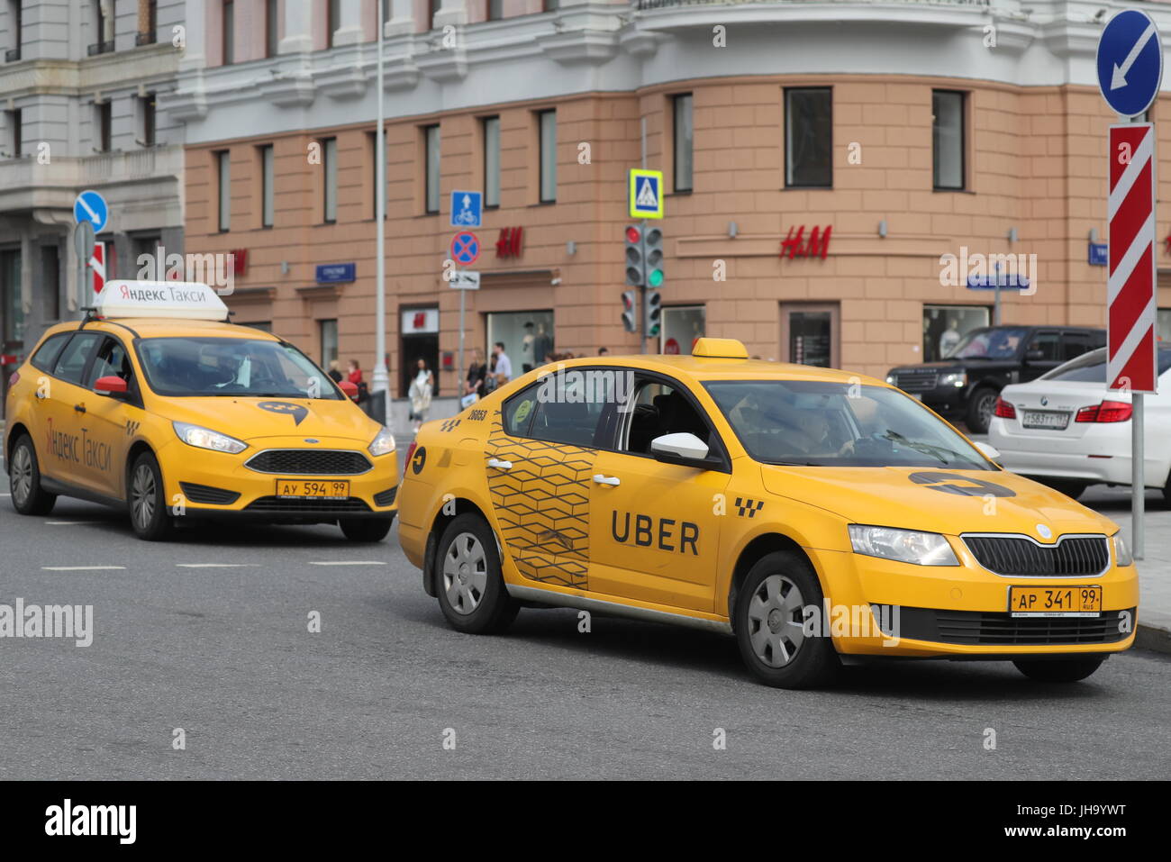 Moscow, Russia. 13th July, 2017. Yandex Taxi and Uber taxicabs in 