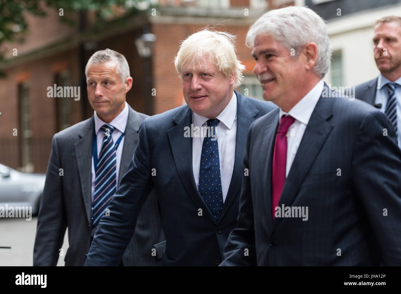London, UK. 13th July 2017. Boris Johnson, the Secretary of State for Foreign Affairs (C) and Alfonso Dastis, Minister of Foreign Affairs of Spain (R), leave 10 Downing Street after a meeting between British Prime Minister Theresa May and the King Felipe VI of Spain. The King and Queen of Spain pay a state visit to the United Kingdom. Credit: Wiktor Szymanowicz/Alamy Live News Stock Photo