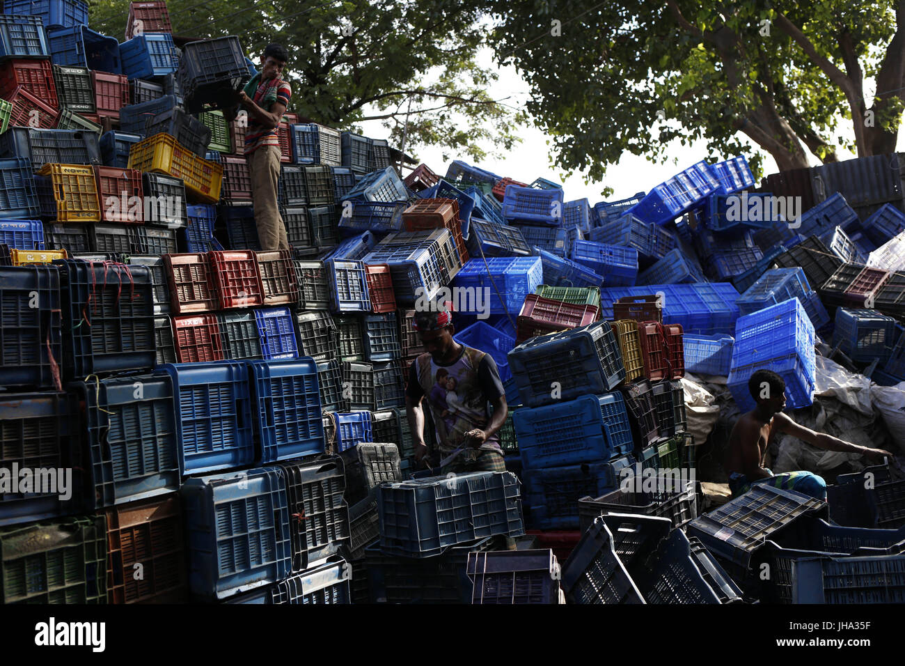 July 13, 2017 Dhaka, Bangladesh Day labors are working at a plastic
