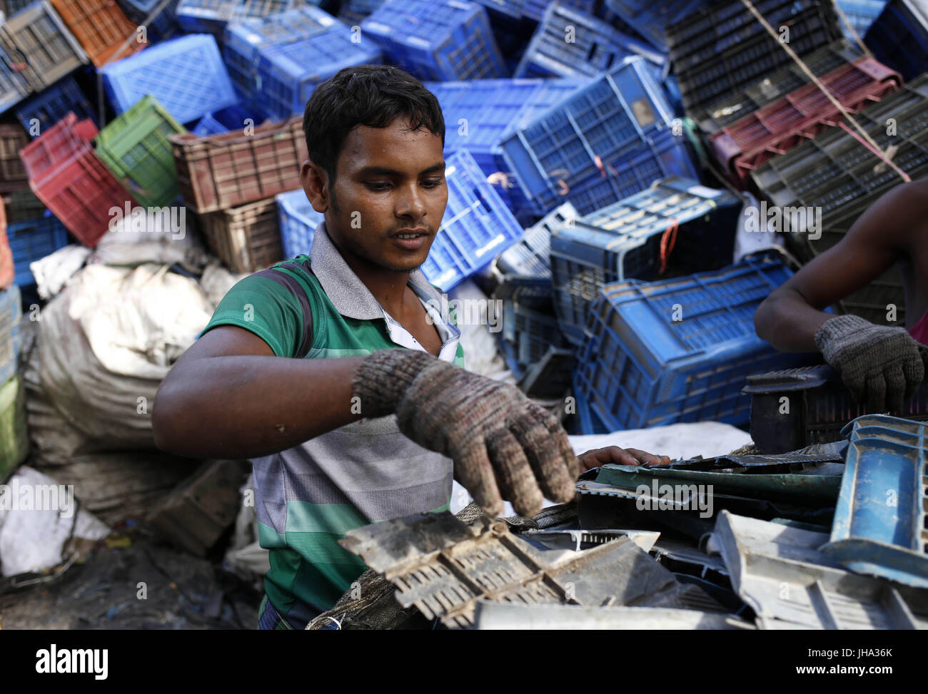 July 13, 2017 Dhaka, Bangladesh A day labor is working a plastic