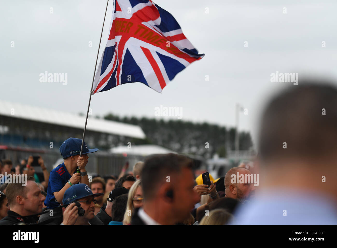 F1 British Grand Prix. Silverstone Race Circuit, UK. Thursday 13 July 2017. Fans, including this young Lewis Hamilton fan, gather to see the drivers at the Formula 1 British Grand Prix. Credit: KEVIN BENNETT/Alamy Live News Stock Photo