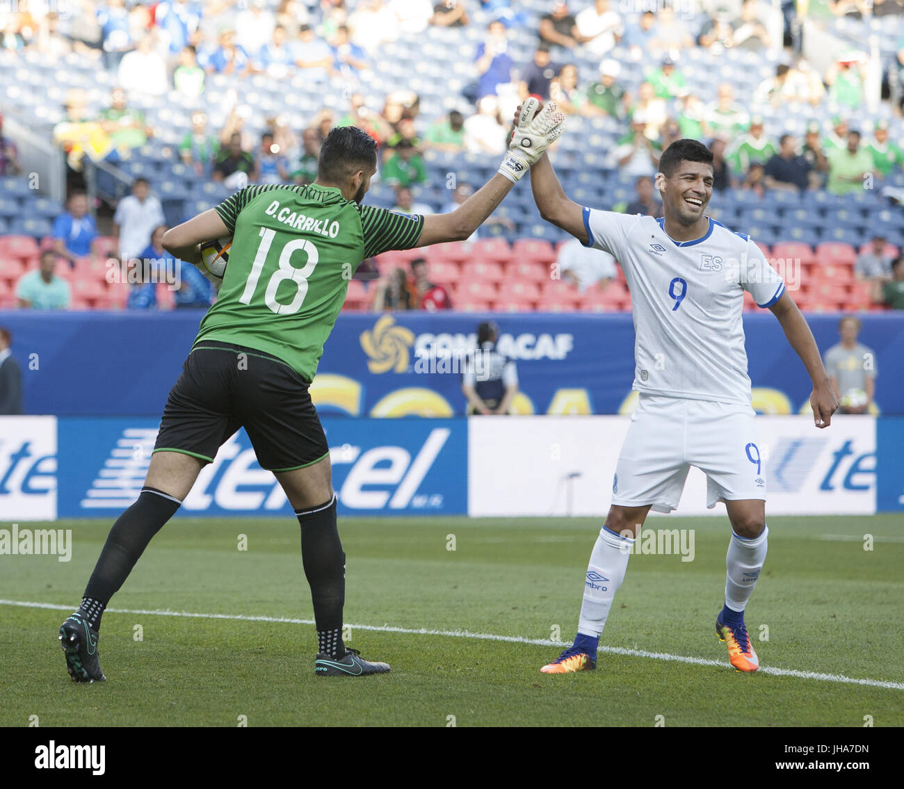 Denver, Colorado, USA. 13th July, 2017. El Salvador G DERBY CARRILLO, left, high fives F NELSON BONILLA, right, after making a save off a penalty kick during the 1st. Half at Sports Authority Field at Mile High during the CONCACAF Gold Cup tournament Thursday night. El Salvador beats Curacao 2-0. Credit: Hector Acevedo/ZUMA Wire/Alamy Live News Stock Photo