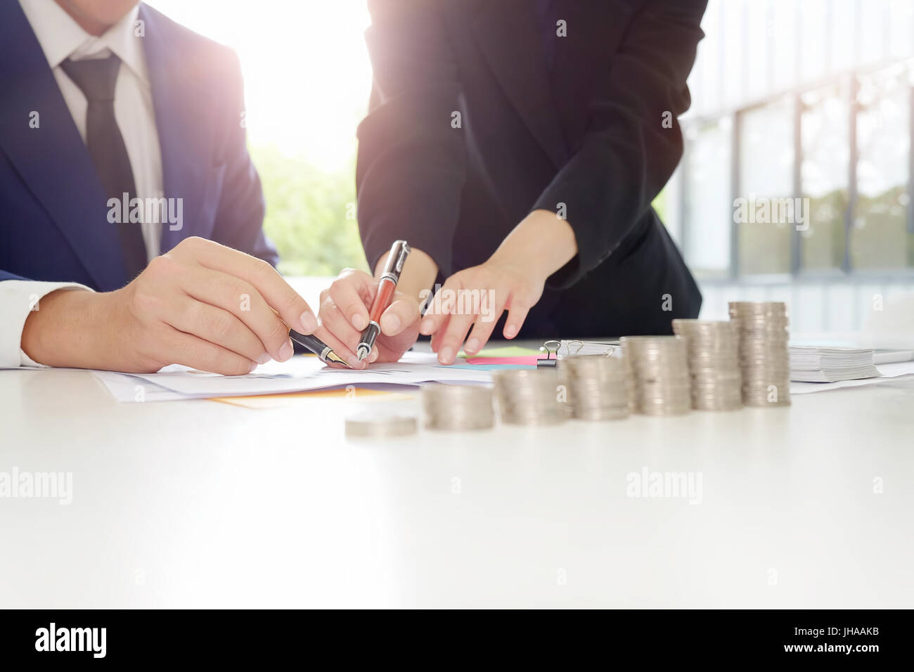 Financial planning Business man and Business woman talking to planner ...