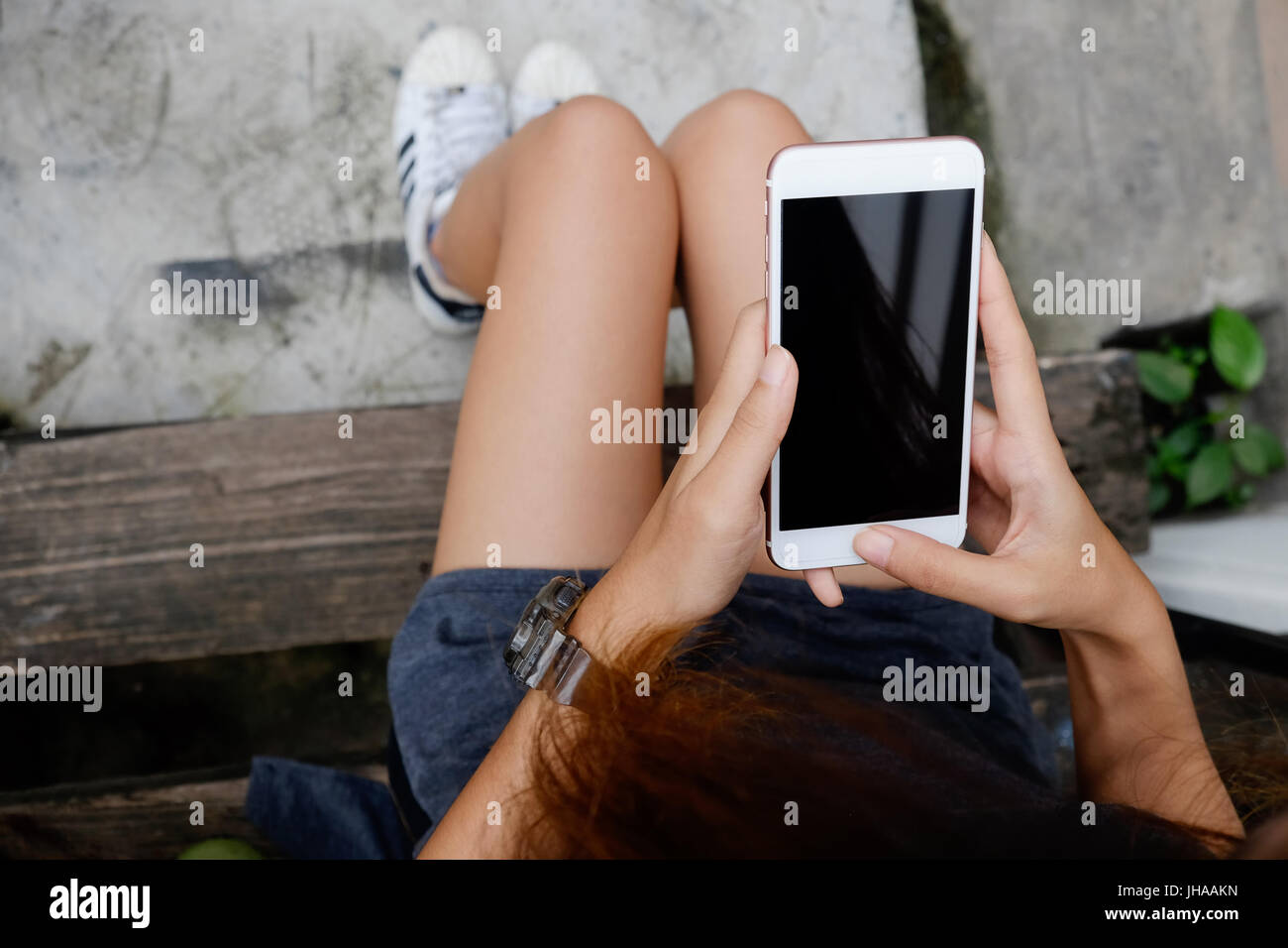 Woman using smartphone above top view. Stock Photo