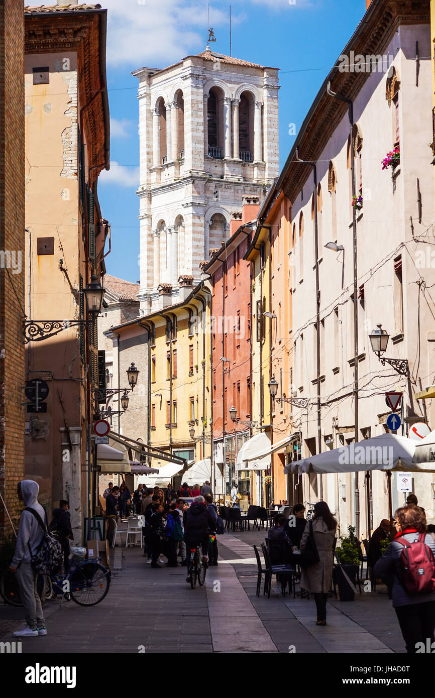 Ferrara, Italy - May 11, 2013. View of old building with people and shops, near the Ferrara Cathedral in the center of Ferrara, a graceful and important medieval town. Emilia-Romagna region Stock Photo