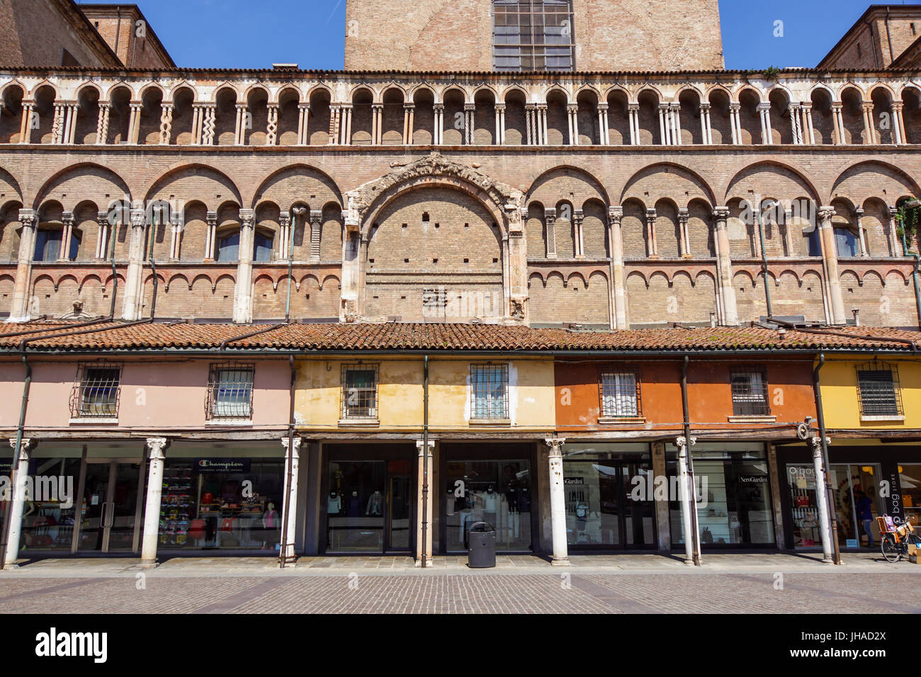 Ferrara, Italy - May 11, 2013. View of old building with people and shops, near the Ferrara Cathedral in the center of Ferrara, a graceful and important medieval town. Emilia-Romagna region Stock Photo