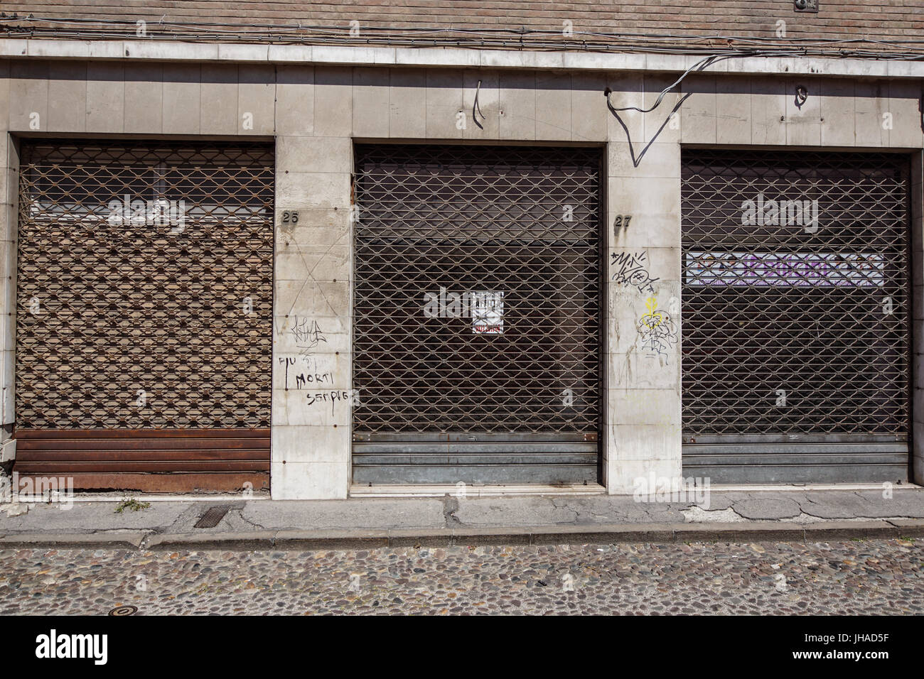 VENICE, ITALY, JUNE 2017. Facade of one of many closed retail stores in the city center due to the opening of large chain stores in the outskirts of the city. Stock Photo