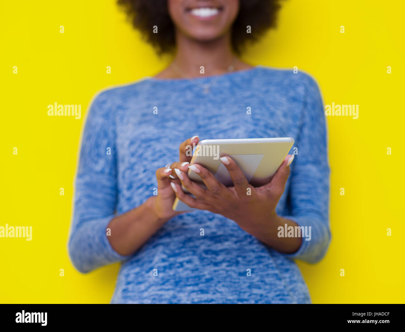 Young Happy African American Woman Using Digital Tablet Isolated on a ...
