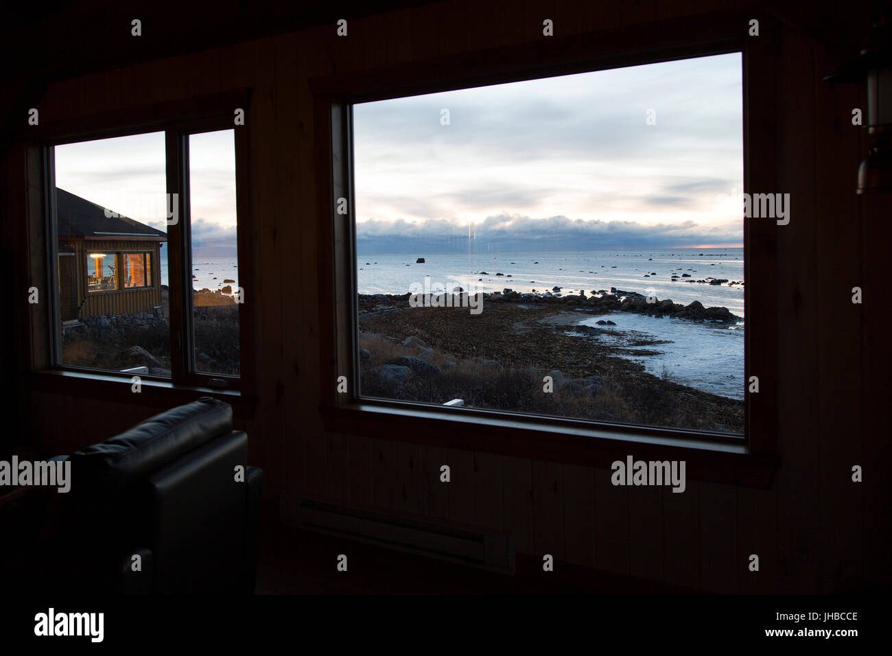 Morning light at Seal River Heritage Lodge in Manitoba, Canada. The window overlooks the Hudson Bay. Stock Photo