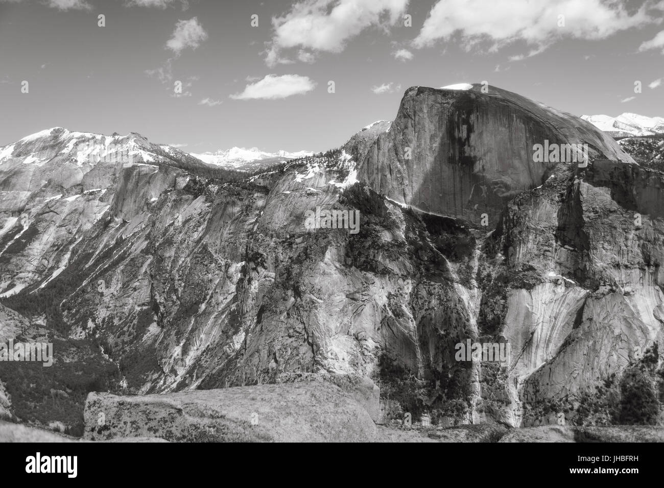 Black and white view of mountains including Half Dome after 16 mile hike on Yosemite Falls trail to the top of North Dome-Photography by Paul Toillion Stock Photo