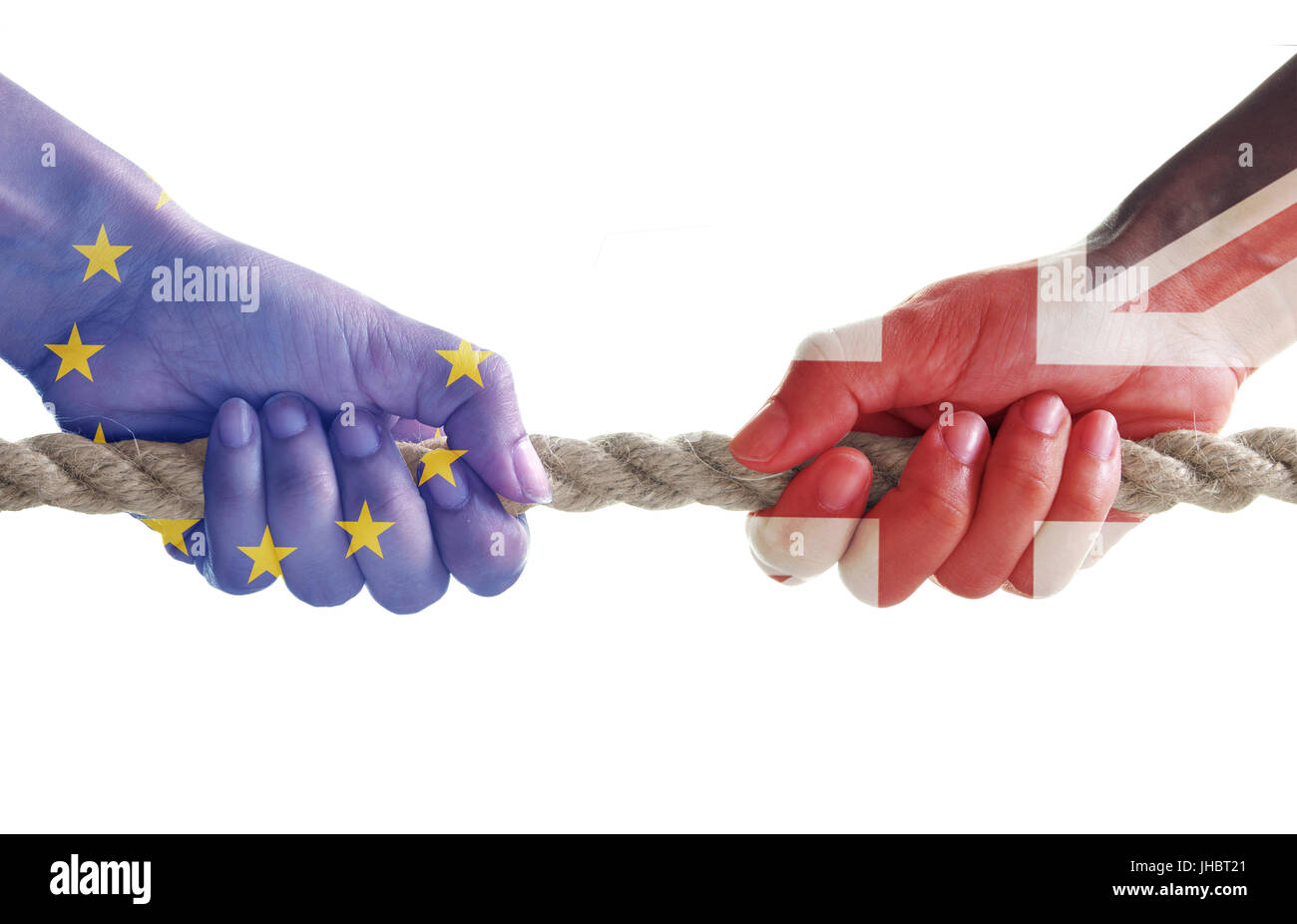 Tug of war between hands painted with UK and European flags Stock Photo
