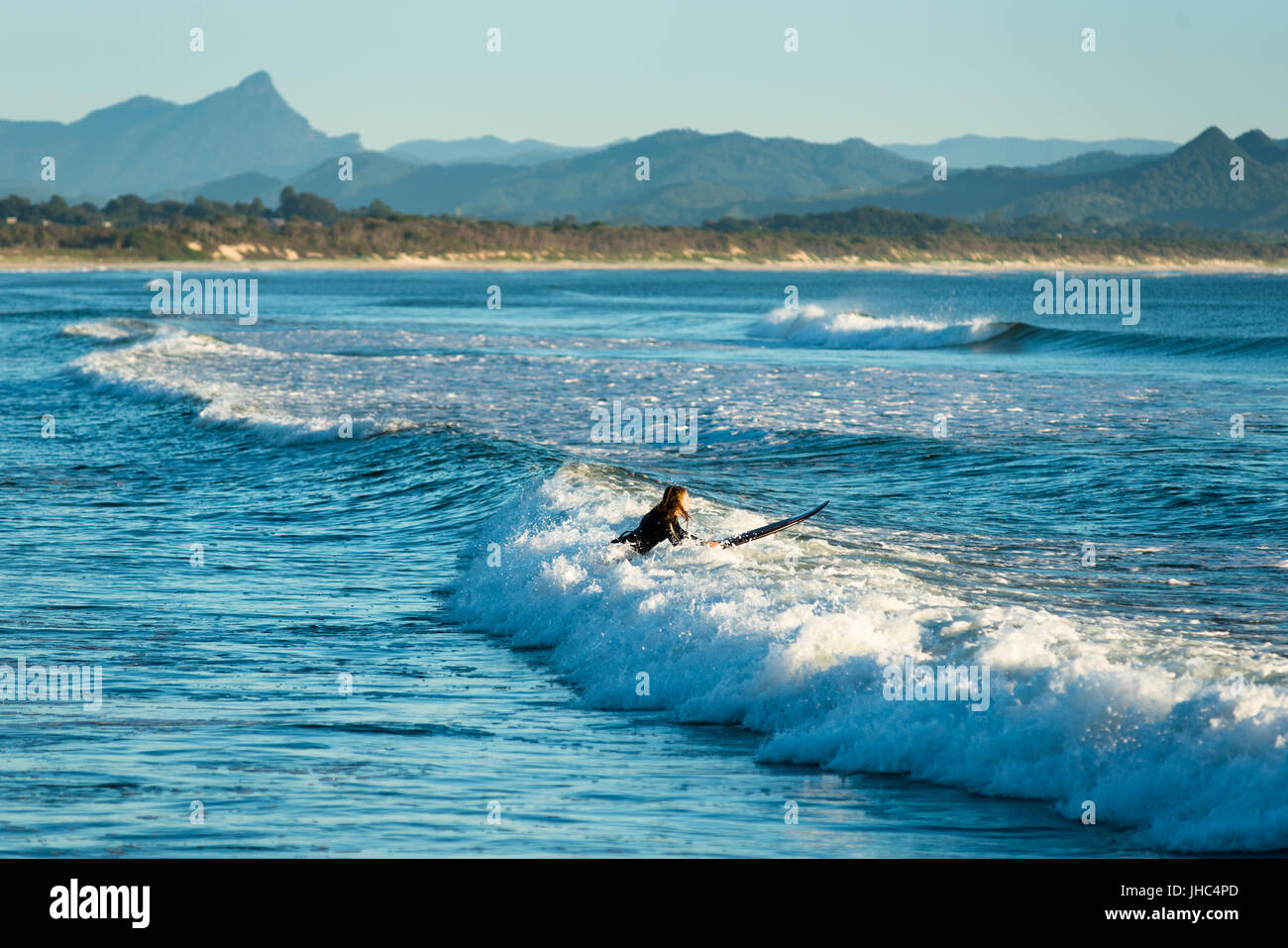 Surfing at "The wreck" off Belongil beach, Byron bay, New South Wales