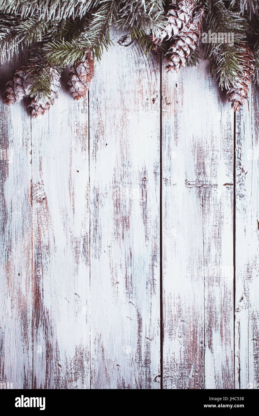 White shabby Christmas border with snow covered pinecones Stock Photo ...