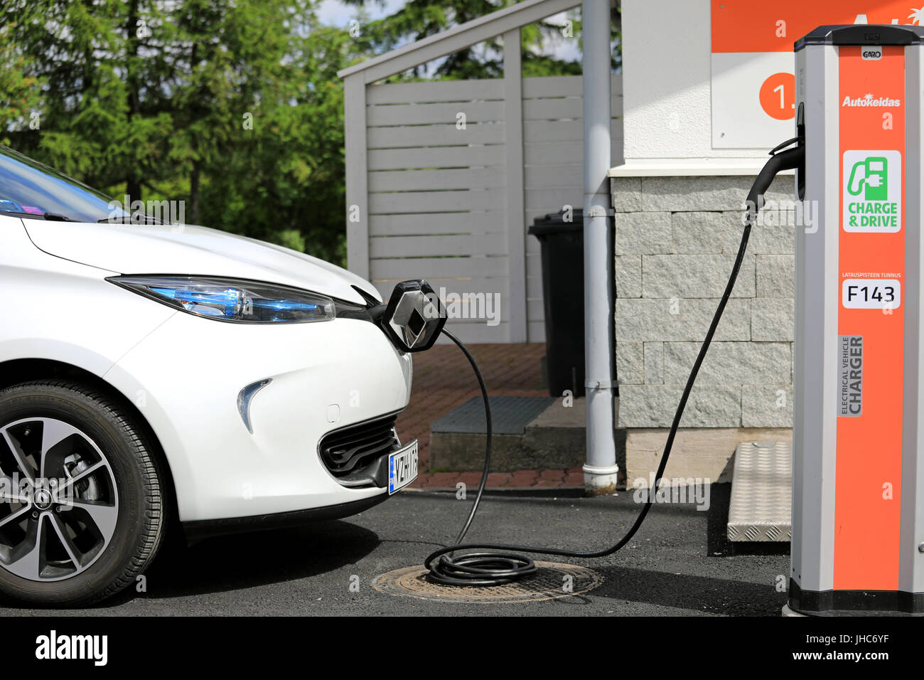 FORSSA, FINLAND - JUNE 23, 2017: White Renault Zoe ZE 40 Electric car is charging battery. The 5 door hatchback ZE 40 has a battery of 41 kWh and maxi Stock Photo