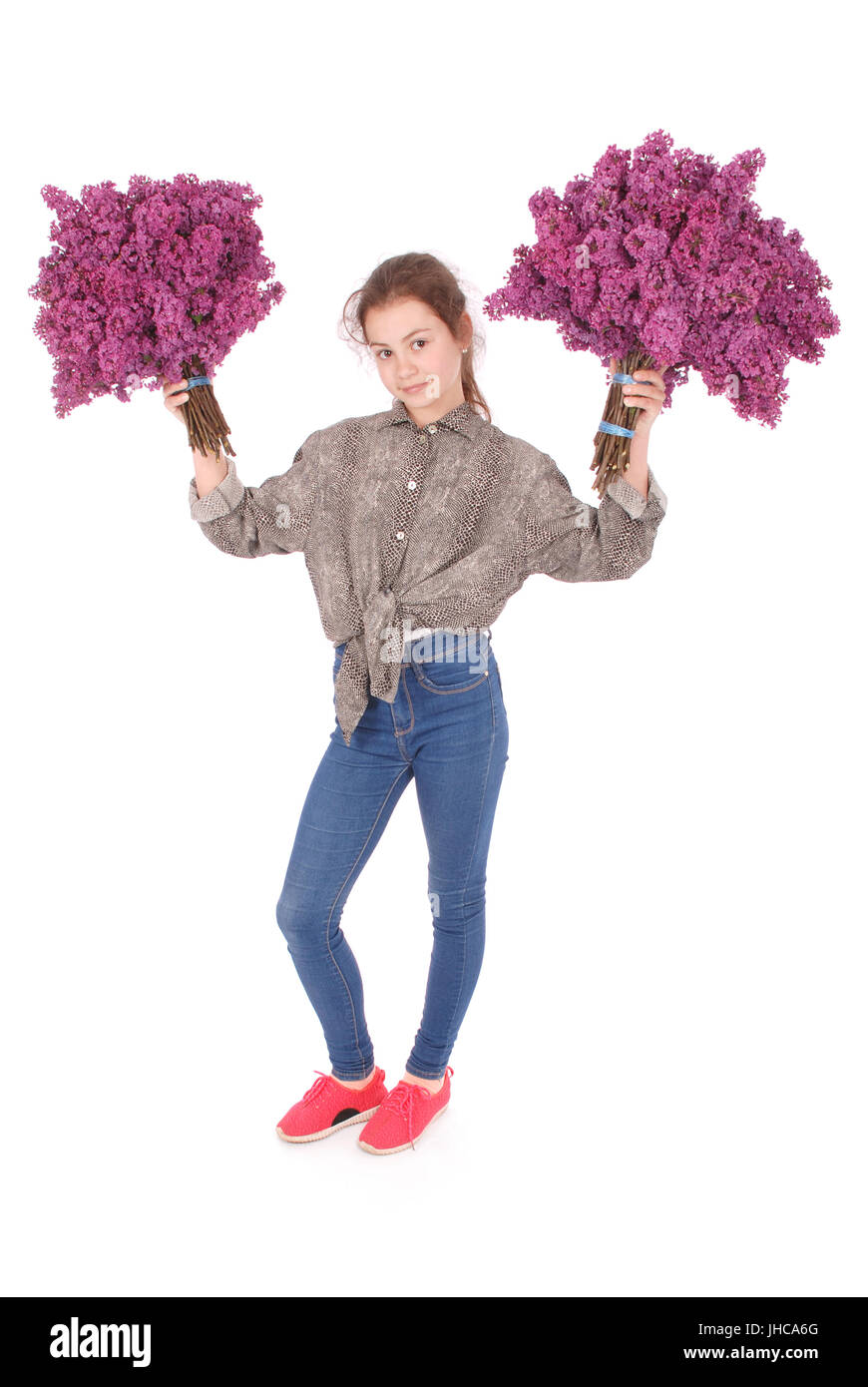 Teenage girl standing with lilac in both hands. Isolated on white ...