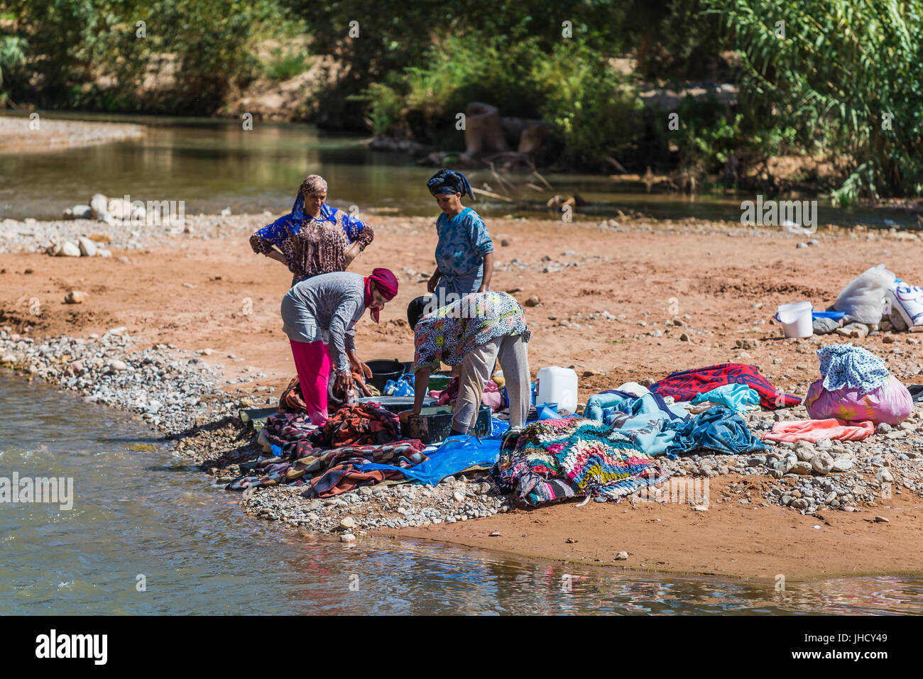 High Atlas, Morocco - September 19, 2015 - women washing laundry in a river Stock Photo