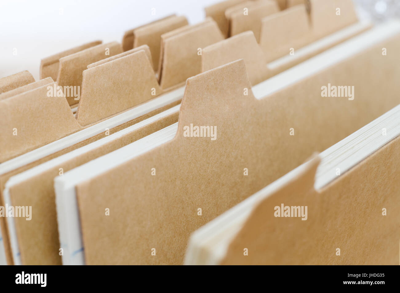 Close up of plain brown index card system dividers, left blank to provide copy space. Stock Photo