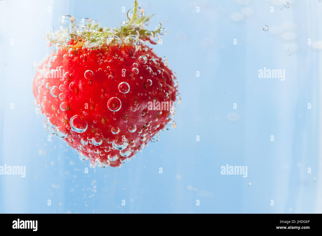 Bubbling air bubbles in water glass hires stock photography and images
