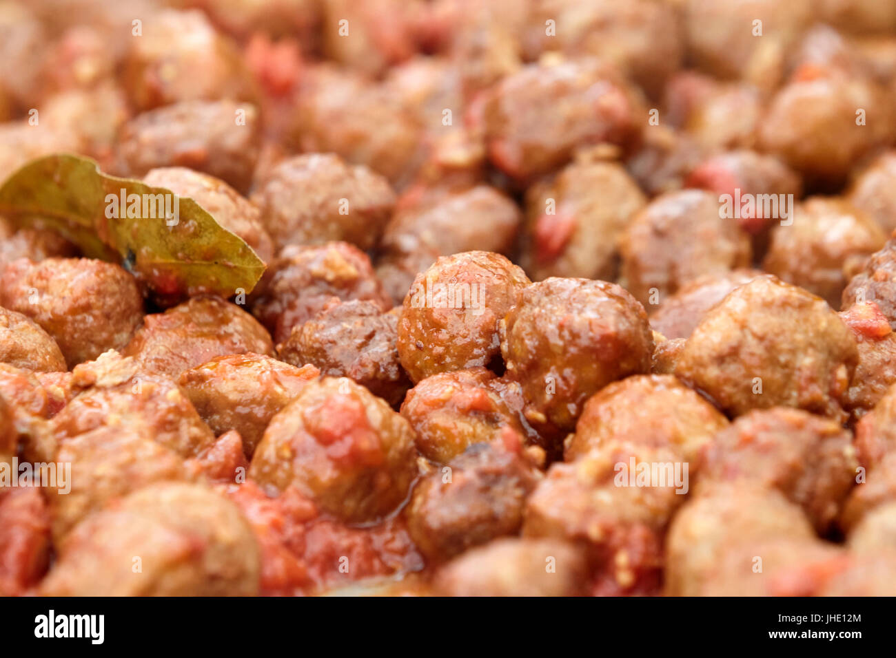 spanish meatballs cooking in sauce Stock Photo Alamy