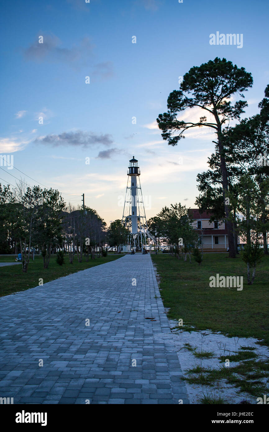 July 2017, Port St. Joe, Florida: The Cape San Blas lighthouse at the end of the path just after sunset. Stock Photo