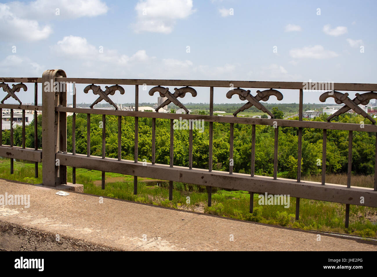 A cast iron railing with pistols as decor for the Calcasieu River Bridge  over I-10 in Lake Charles Stock Photo - Alamy