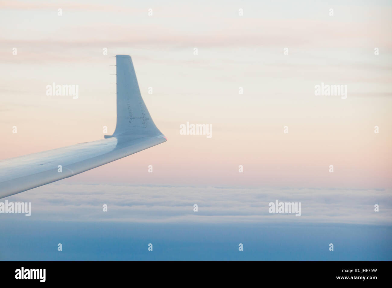landscape above the clouds sunset wing flight Stock Photo - Alamy