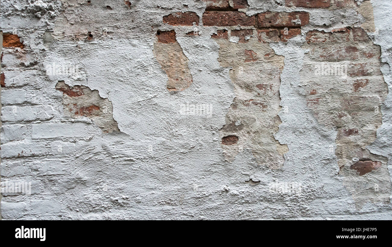 distressed painted white brick wall with chipped paint Stock Photo Alamy