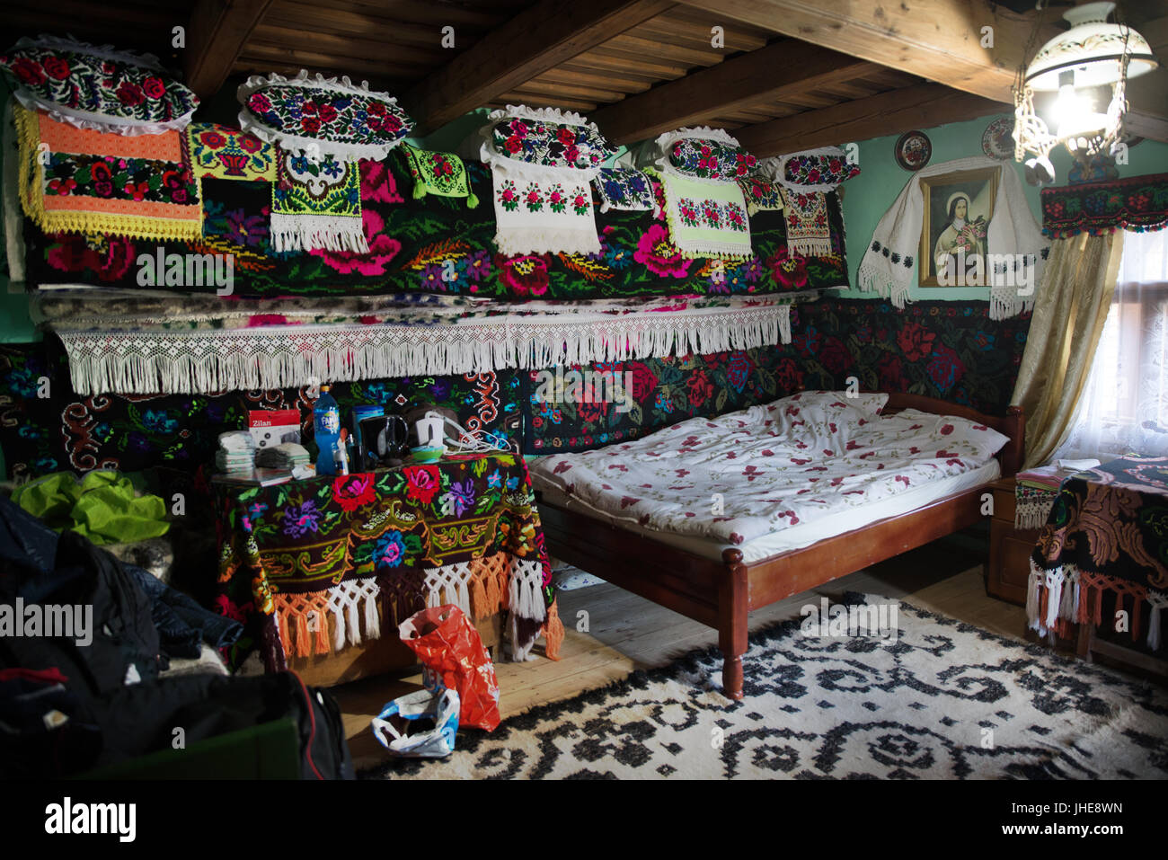 Traditional bedroom with colourful embroidery, Breb, Maramures, Romania Stock Photo