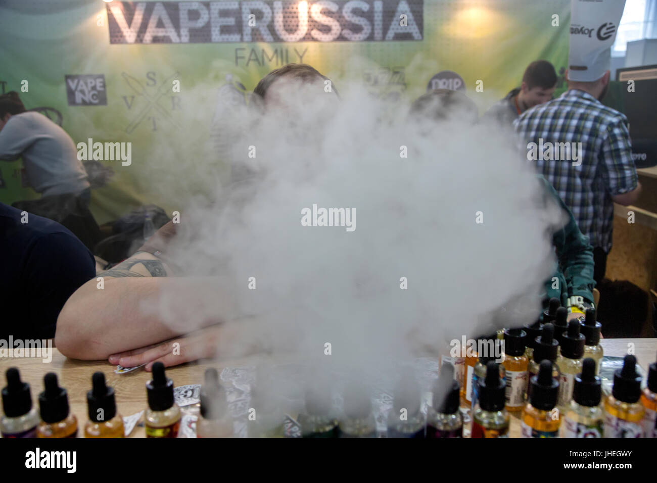 A man smokes electronic cigarettes at the 