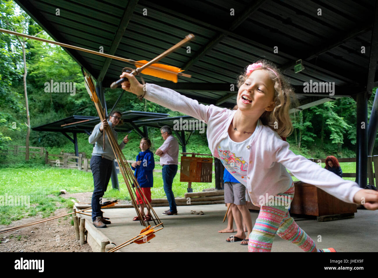Prehistoric Park, Museographic Area, Tarascon, Ariege, France. Family with children learn to use spear-thrower. Stock Photo