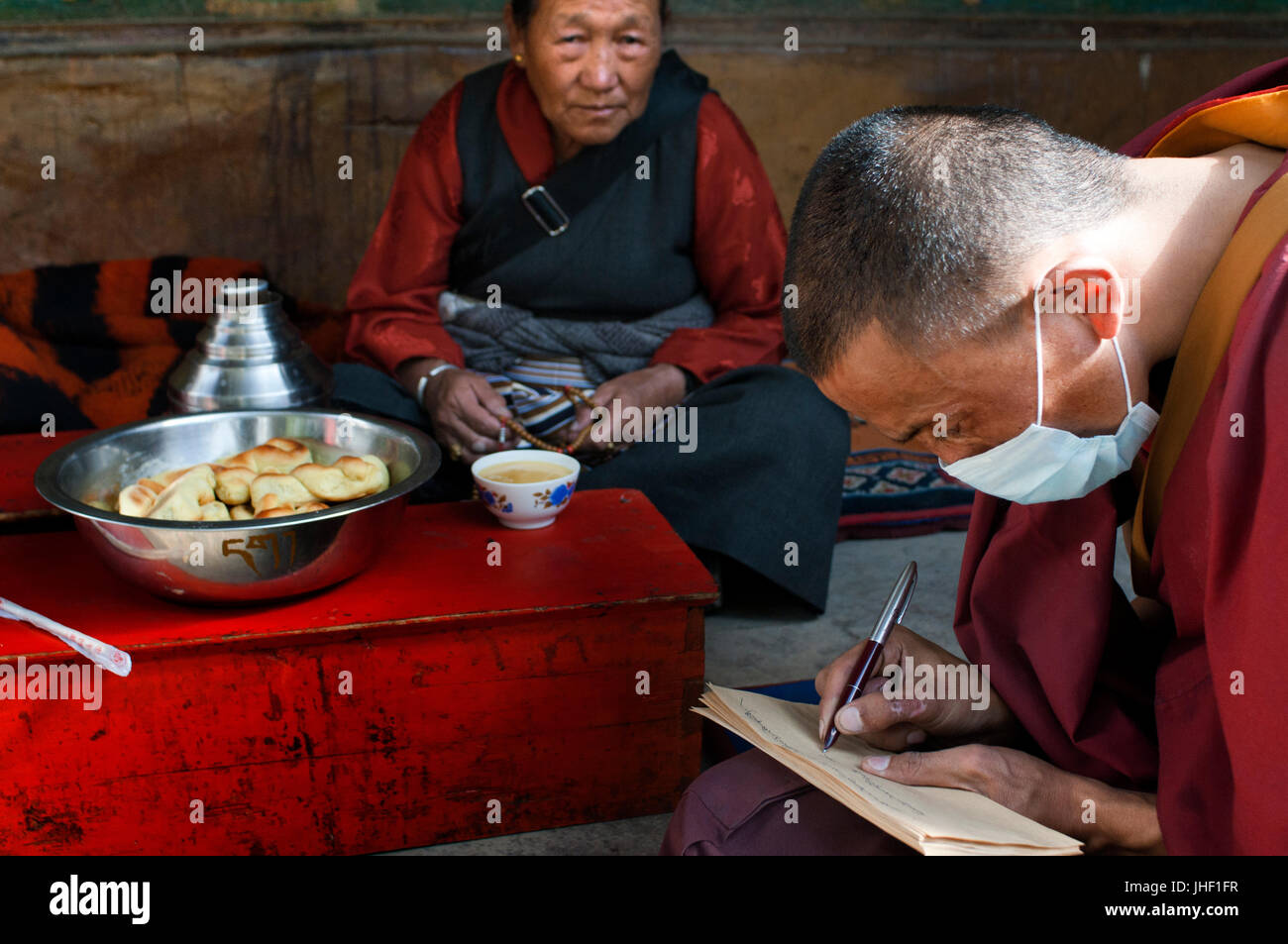 Monks inside Tashilumpo Monastery at Shigatse, Tibet, China Stock Photo