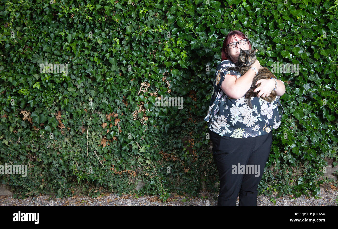 Claire Hopkins and her cat Tinks named Cat of the Year 2016 in annual National Cat Awards for saving her family from a house fire Stock Photo