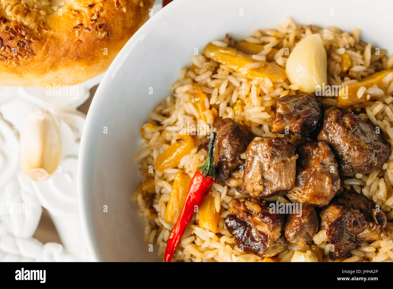 Uzbek Pilaf Rice with Meat and Vegetables on the table. Pilaf with