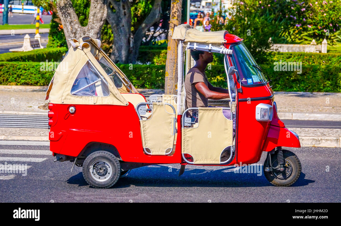 Small Tuk Tuk Car in the streets of Lisbon - LISBON, PORTUGAL 2017 Stock Photo