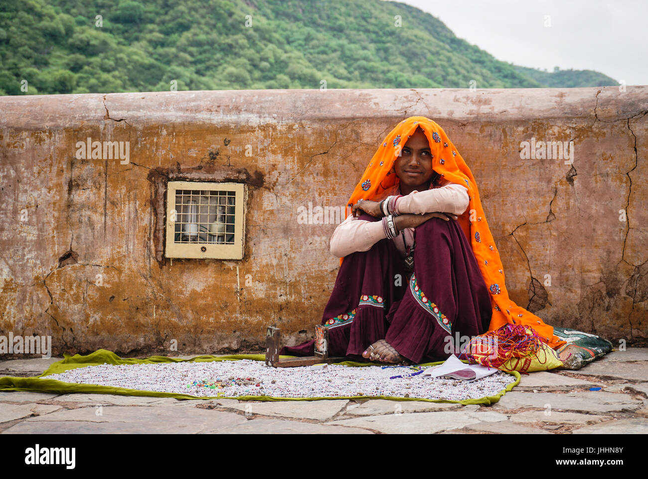 Jaipur, India - Jul 28, 2015. A vendor selling souvenir at Amer Fort in Jaipur, India. Jaipur is the capital and largest city of the Indian state of R Stock Photo