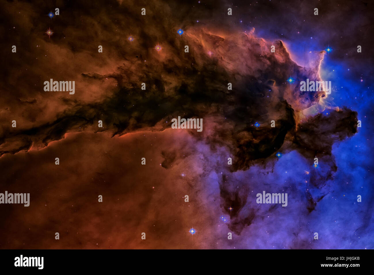 A billowing tower of gas and dust rises from the stellar nursery known