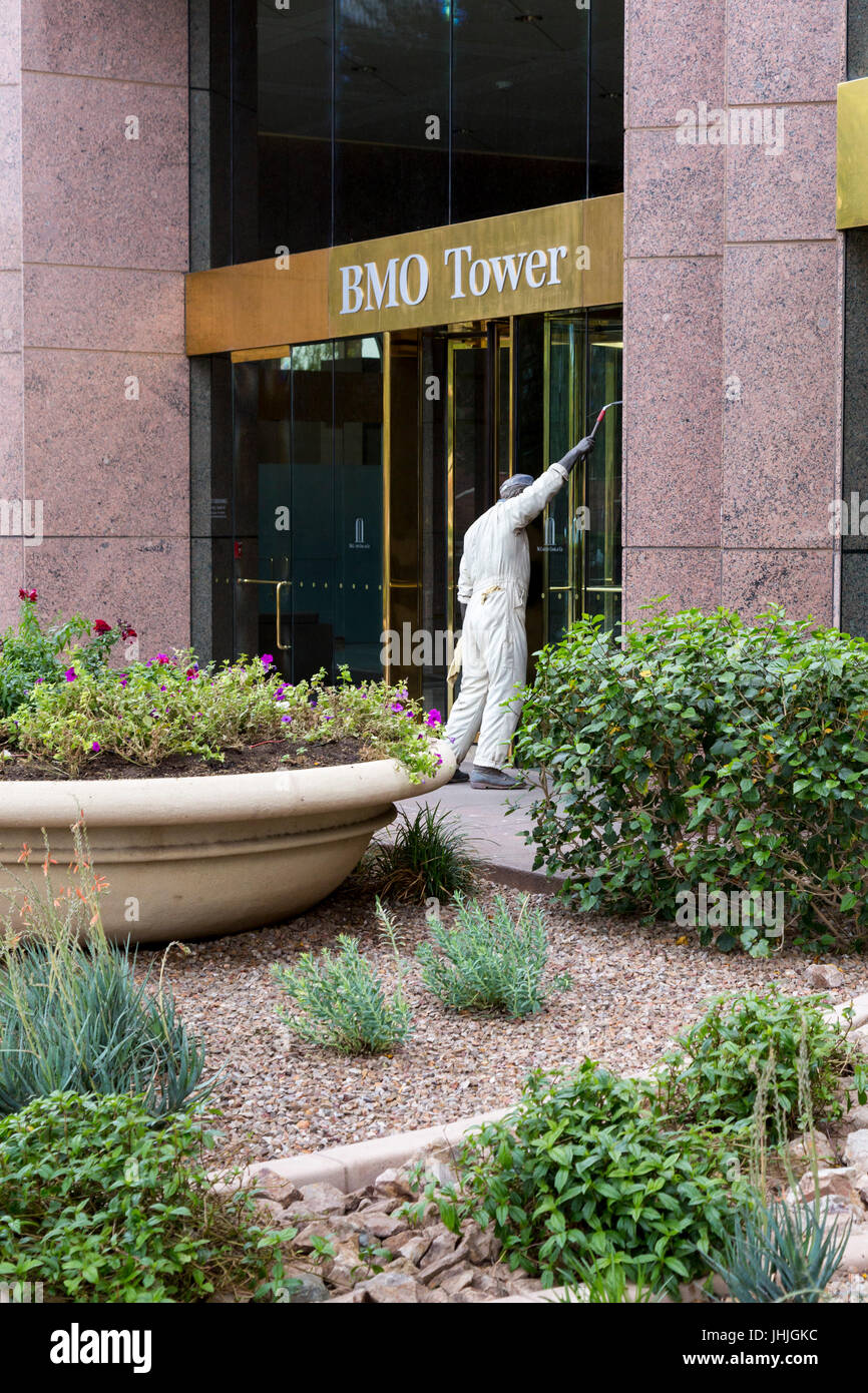Phoenix, Arizona - Sculpture of a window washer at the entrance to the BMO Tower. The sculpture is called 'Nice to See You.' Stock Photo