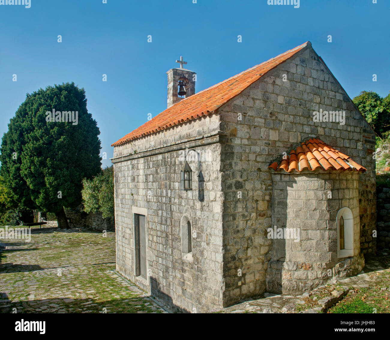 small medieval church and tree in stari bar, montenegro Stock Photo