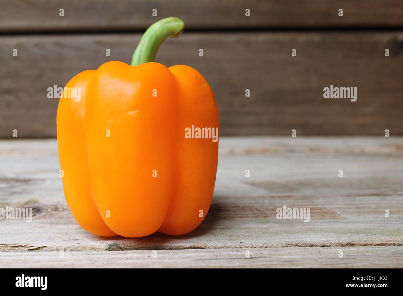 peppers on wood table Stock Photo - Alamy