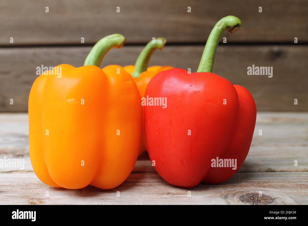 peppers on wood table Stock Photo - Alamy