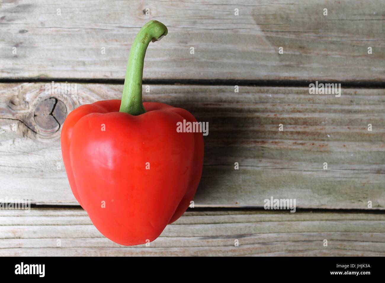 peppers on wood table Stock Photo - Alamy