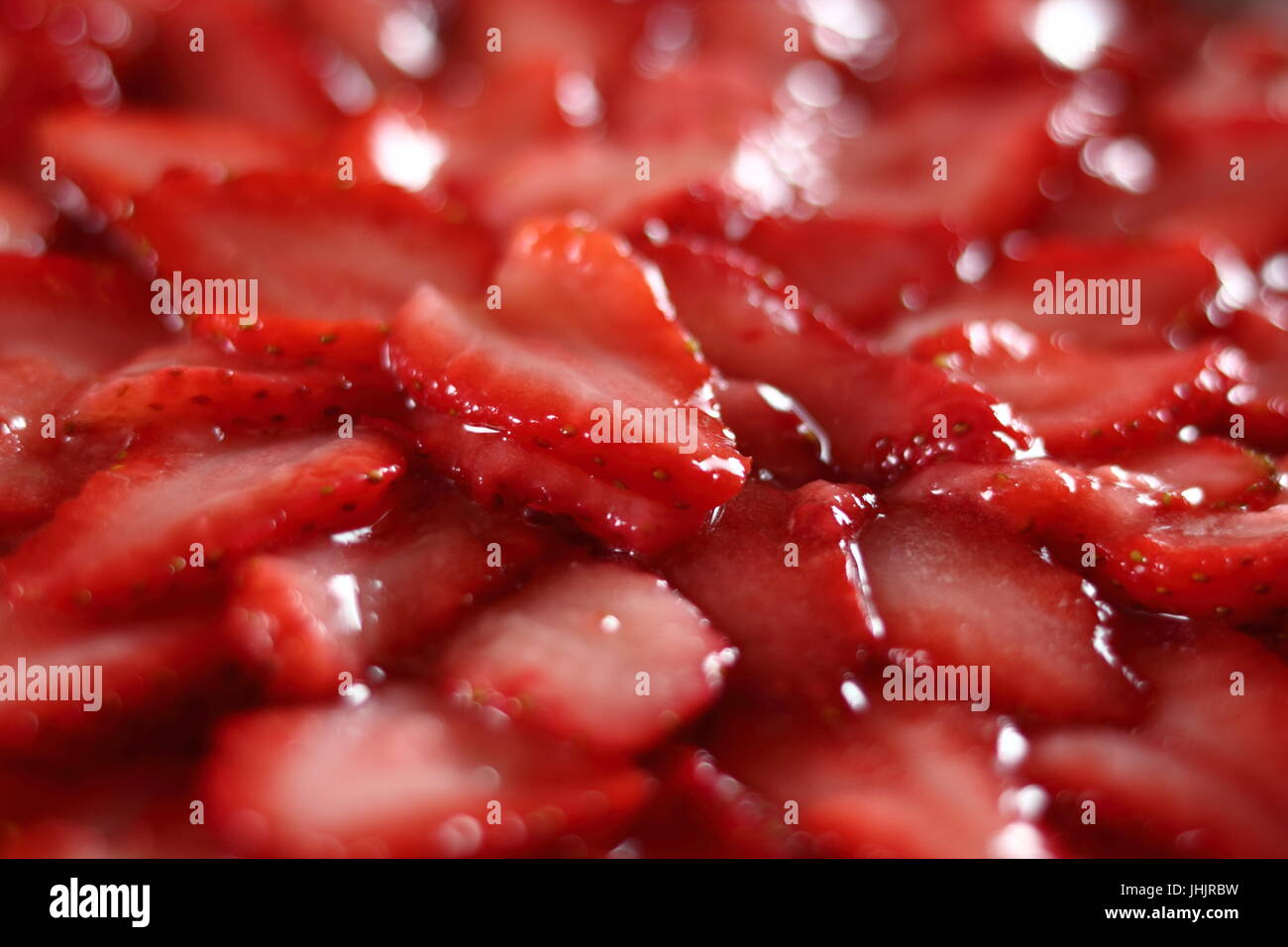 Sliced strawberry topping. Making frozen strawberry cheesecake series