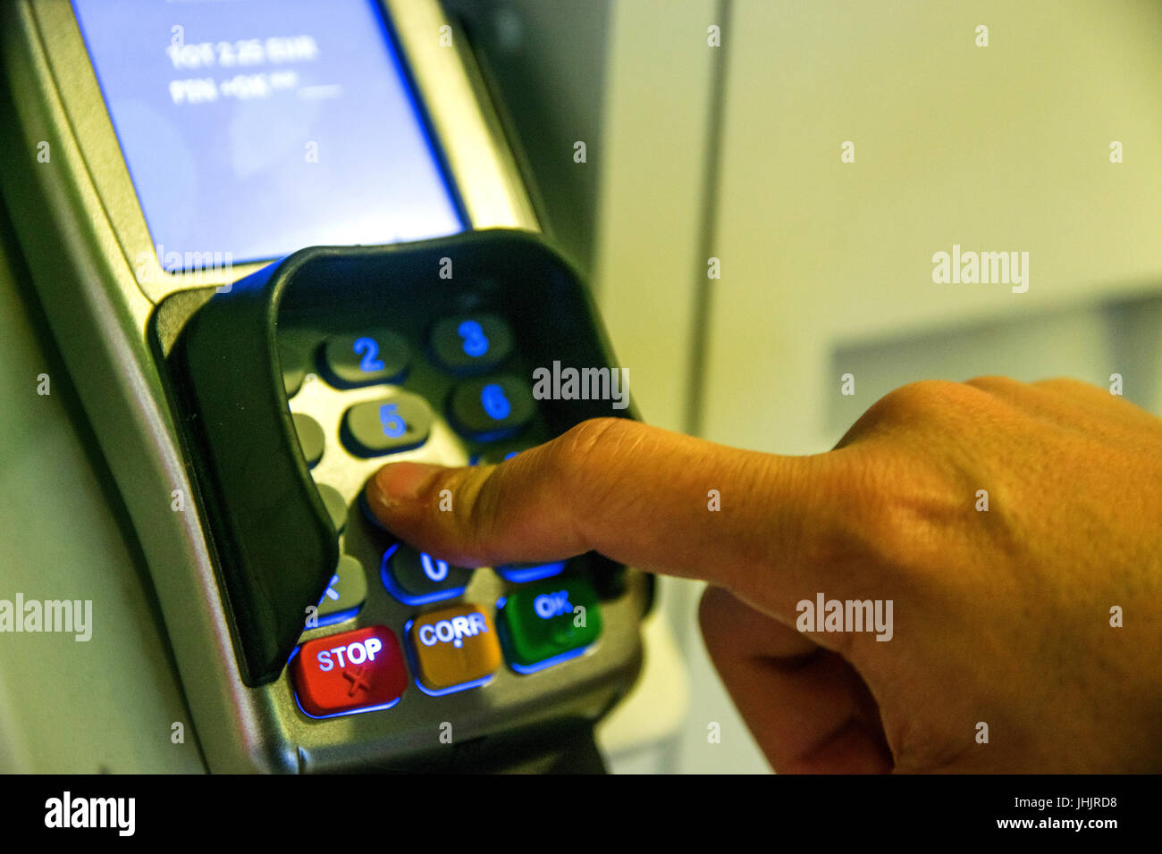 Person Using Keypad Atm Machine To Withdraw Money Stock Photo